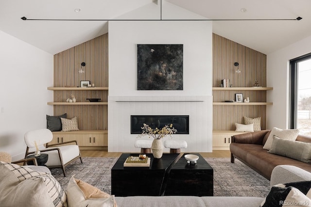 living room with hardwood / wood-style flooring and lofted ceiling