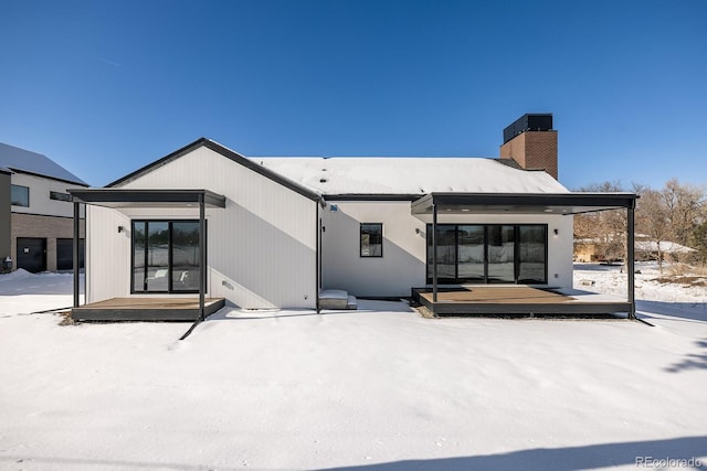 view of snow covered house