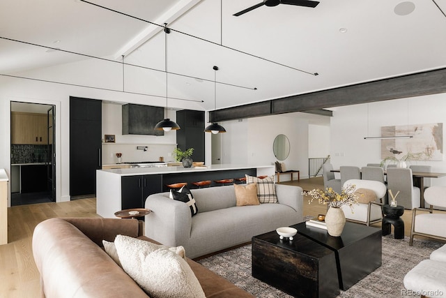 living room featuring light hardwood / wood-style flooring and ceiling fan