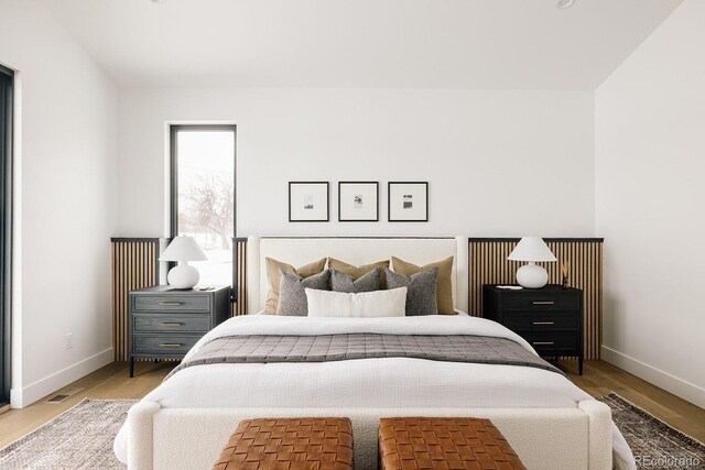 bedroom with light wood-type flooring