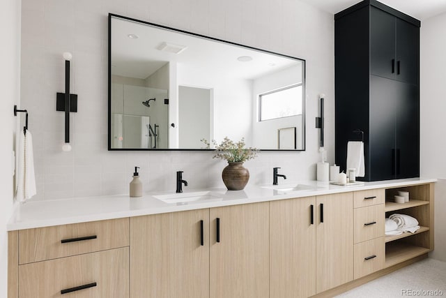 bathroom featuring walk in shower, vanity, and decorative backsplash