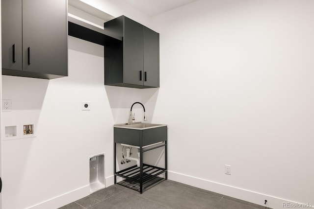 laundry room with cabinets, washer hookup, hookup for an electric dryer, and sink