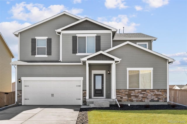 view of front of property with a front yard and a garage