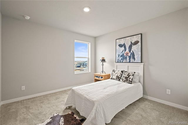 bedroom featuring light colored carpet