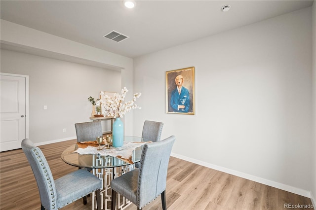 dining area with light wood-type flooring