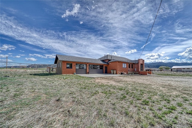 rear view of property with a yard