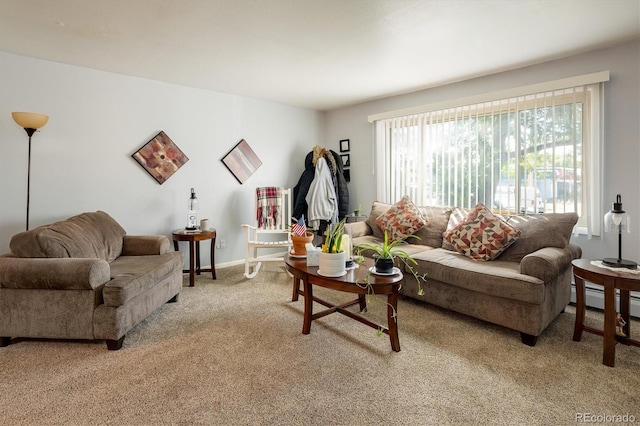 carpeted living room with a baseboard radiator