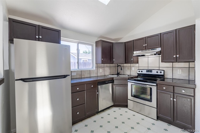 3570 Center Ave, Denver, CO 80219 - kitchen featuring stainless steel appliances, under cabinet range hood, dark brown cabinets, vaulted ceiling, and decorative backsplash