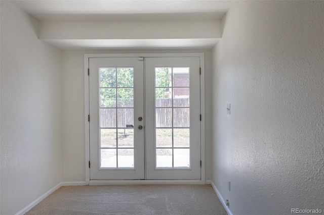 3570 Center Ave, Denver, CO 80219 - entryway featuring light carpet, french doors, and a textured wall