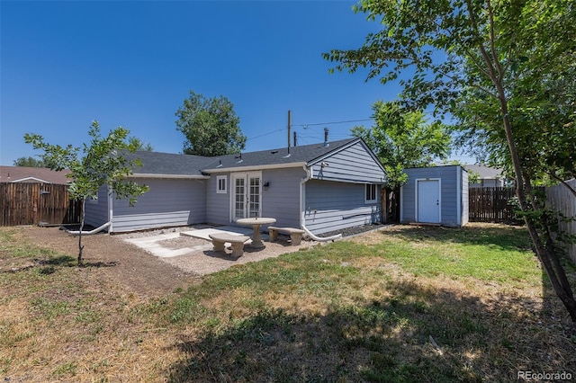 3570 Center Ave, Denver, CO 80219 - back of property featuring a fenced backyard and a storage shed