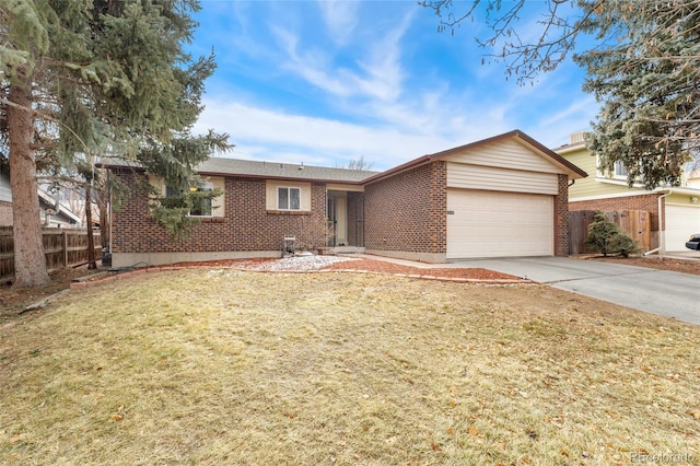 ranch-style house with a garage and a front lawn