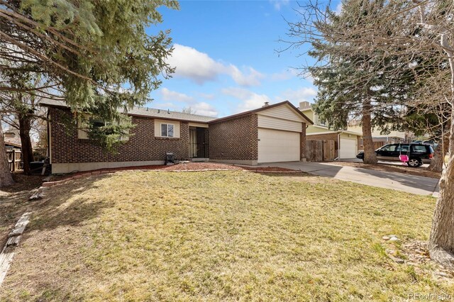 15104 E Utah Pl, Aurora, CO 80012 - ranch-style home featuring brick siding, a garage, a front lawn, and driveway
