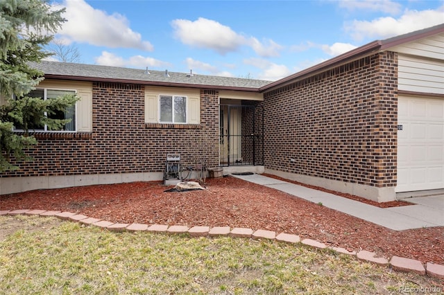 15104 E Utah Pl, Aurora, CO 80012 - single story home featuring an attached garage and brick siding