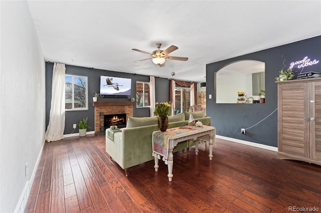 15104 E Utah Pl, Aurora, CO 80012 - living room with wood-type flooring, baseboards, ceiling fan, and a fireplace