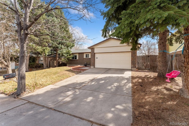 15104 E Utah Pl, Aurora, CO 80012 - ranch-style home featuring brick siding, an attached garage, driveway, and fence
