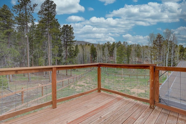 9288 Krashin Dr, Conifer, CO 80433 - deck featuring a wooded view