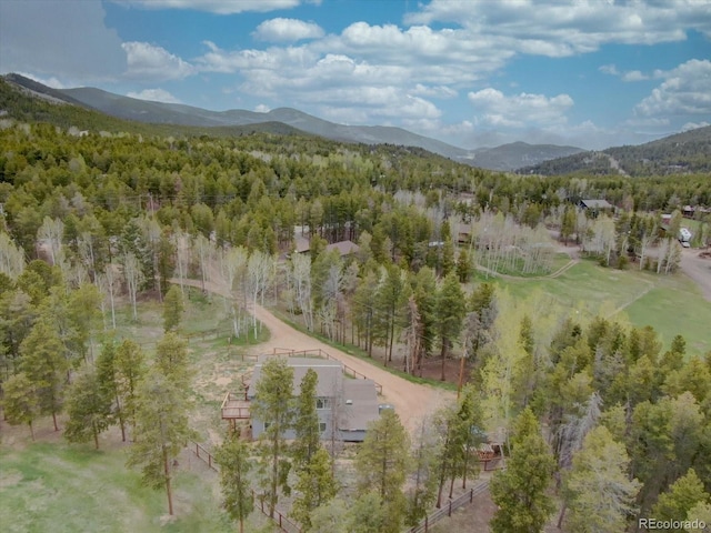 9288 Krashin Dr, Conifer, CO 80433 - view of property location featuring a mountainous background and a heavily wooded area