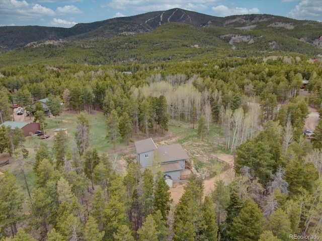 9288 Krashin Dr, Conifer, CO 80433 - aerial view of property and surrounding area featuring a forest and mountains