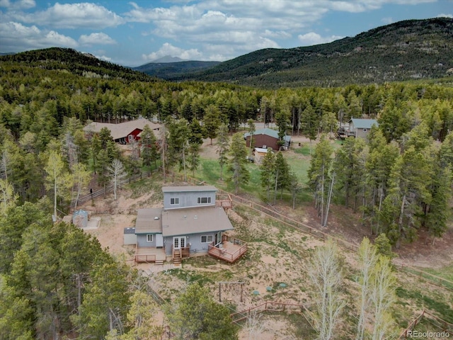 9288 Krashin Dr, Conifer, CO 80433 - aerial overview of property's location with a forest and a mountain backdrop