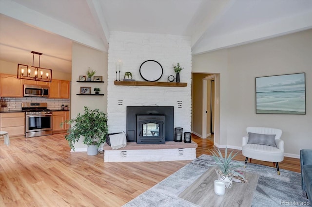 9288 Krashin Dr, Conifer, CO 80433 - living room with light wood-style floors, baseboards, and a chandelier