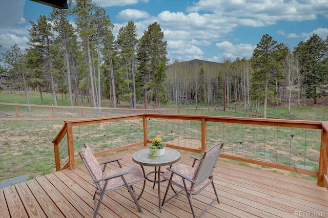 9288 Krashin Dr, Conifer, CO 80433 - wooden deck featuring a view of trees