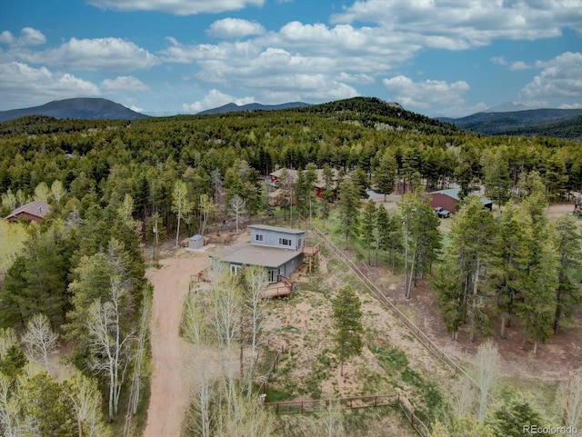 9288 Krashin Dr, Conifer, CO 80433 - aerial view of property's location featuring a heavily wooded area and a mountainous background