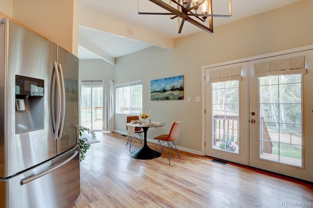9288 Krashin Dr, Conifer, CO 80433 - kitchen featuring stainless steel fridge with ice dispenser, light wood-type flooring, french doors, a chandelier, and beam ceiling