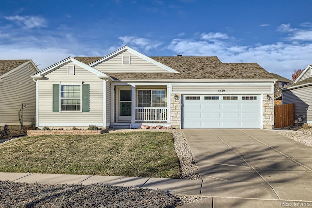 view of front of house featuring a front yard and a garage