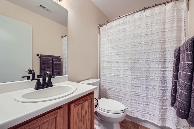 bathroom with tile patterned floors, vanity, and toilet