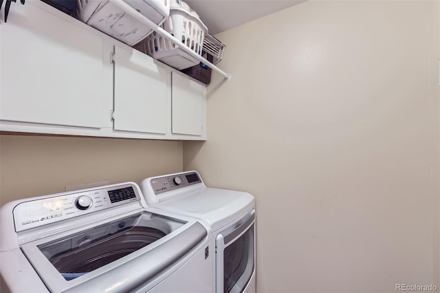 laundry area featuring cabinets and independent washer and dryer