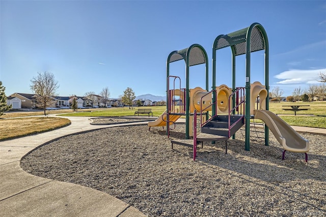 view of playground featuring a lawn