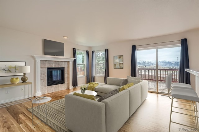 16645 W 2nd Ave, Golden, CO 80401 - living room with light wood-type flooring and a fireplace