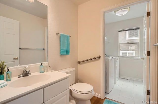 16645 W 2nd Ave, Golden, CO 80401 - bathroom featuring washer and dryer and vanity