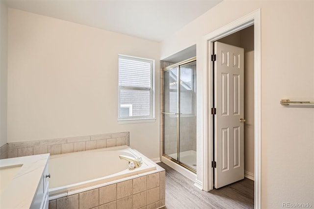 16645 W 2nd Ave, Golden, CO 80401 - full bath featuring a shower stall, a bath, wood finished floors, and vanity