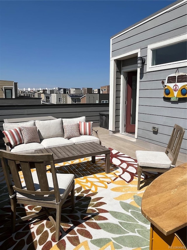 view of patio featuring an outdoor hangout area and a balcony