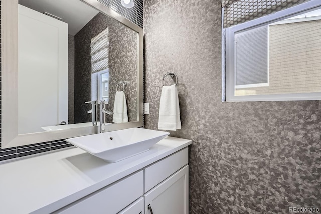 bathroom with a wealth of natural light and vanity