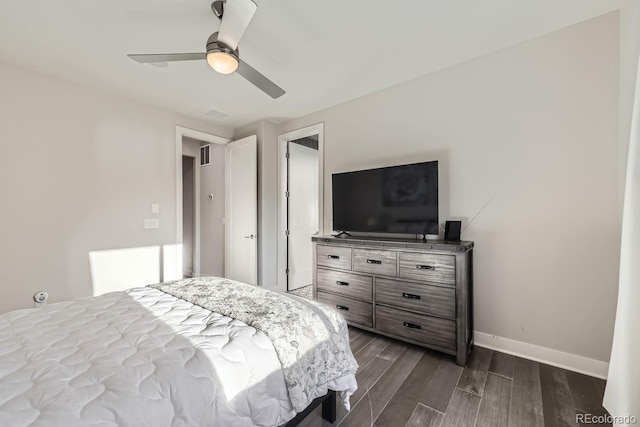 bedroom featuring ceiling fan and dark hardwood / wood-style flooring