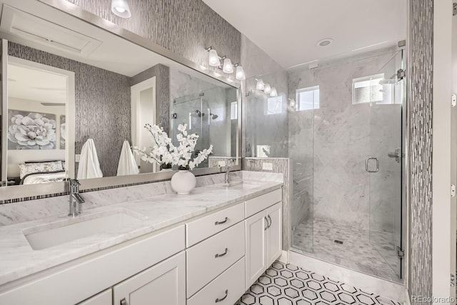 bathroom featuring vanity, a shower with shower door, and tile patterned floors