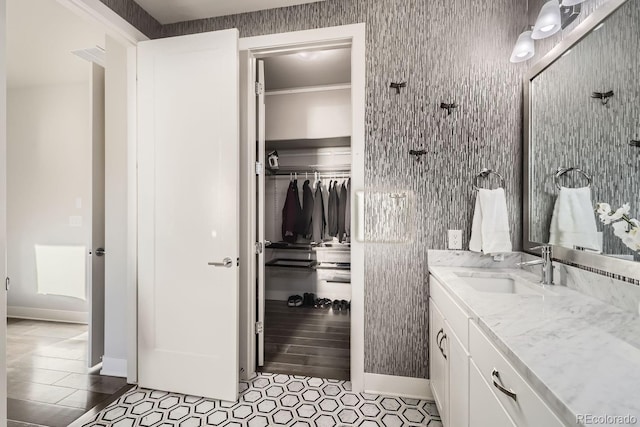 bathroom with vanity and ornamental molding