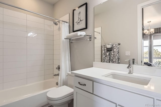 full bathroom featuring shower / bathtub combination with curtain, vanity, a notable chandelier, and toilet