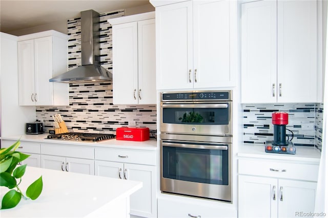 15878 E Broncos Pl, Englewood, CO 80112 - kitchen featuring stainless steel appliances, wall chimney range hood, decorative backsplash, and light countertops