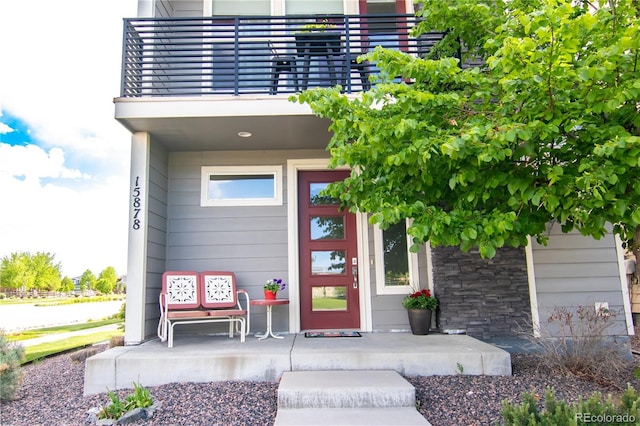 15878 E Broncos Pl, Englewood, CO 80112 - view of exterior entry with a porch and stone siding