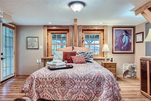 903 High Rd, Manitou Springs, CO 80829 - bedroom with wood finished floors and a textured ceiling
