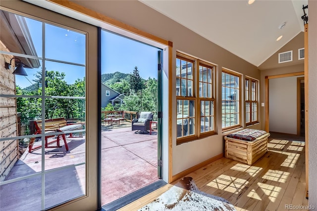 903 High Rd, Manitou Springs, CO 80829 - entryway with vaulted ceiling, wood finished floors, and healthy amount of natural light