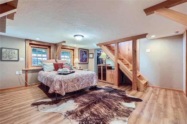 903 High Rd, Manitou Springs, CO 80829 - bedroom with wood finished floors and a textured ceiling