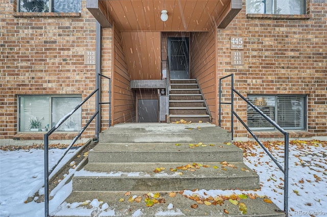 view of snow covered property entrance