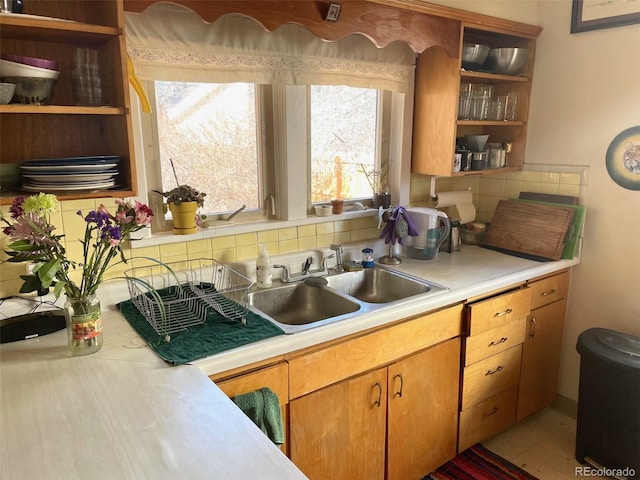 kitchen featuring sink and decorative backsplash