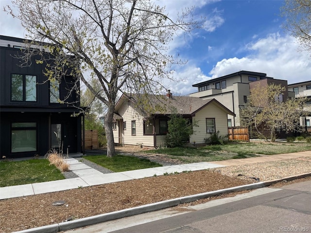 3953 Vrain St, Denver, CO 80212 - traditional-style home featuring a front lawn and fence