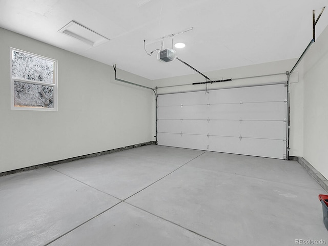 8694 E Eastman Ave, Denver, CO 80231 - garage featuring a garage door opener and baseboards
