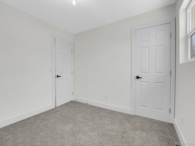 8694 E Eastman Ave, Denver, CO 80231 - unfurnished bedroom with carpet floors and baseboards